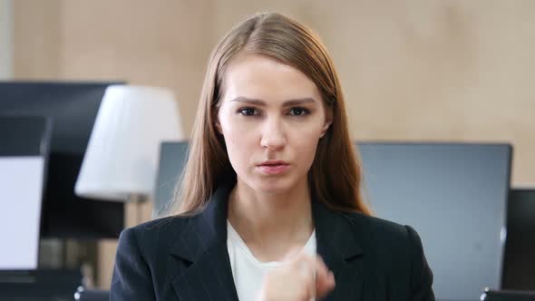 Silence by Woman in Office, Finger on Lips