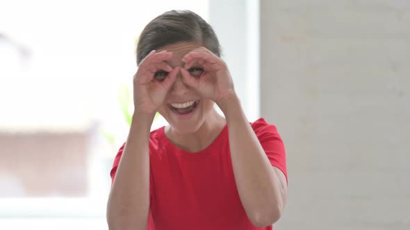 Indian Woman Searching with Handmade Binocular