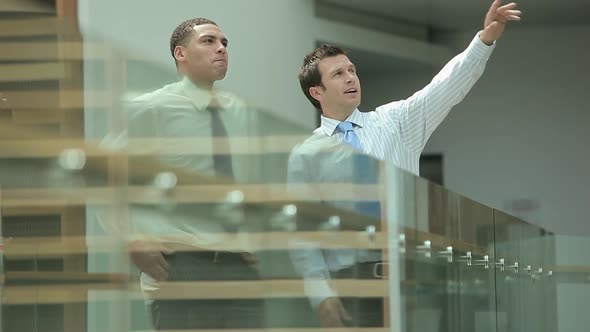 Businessmen looking at office building