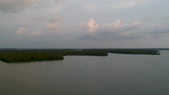 Beautiful aerial shot of a backwater island,Vembanad lake Asia,Sunset clouds