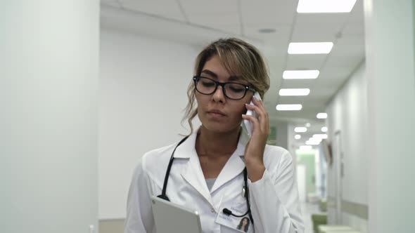 Female Practitioner Speaking on Phone