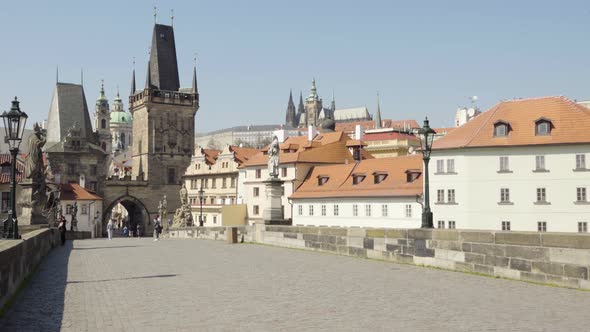 Nearly Empty Charles Bridge with People in Prague, Czech Republic During the Coronavirus Pandemic