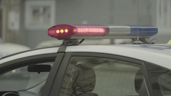 Flashing Flasher on the Roof of a Police Car. Blinker. Close-up.