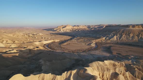 Aerial footage at Sde Boker, in Neguev desert of Israel. Dry river in the desert landscape.