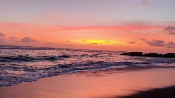 Pink Sunset in Bali Beach Ocean Water Waves on Shore Golden Hour