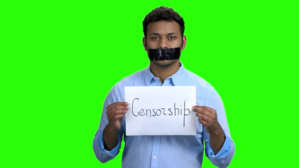 Indian Man with Taped Mouth on Green Screen