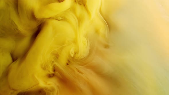 Ink Water Flow. Magic Explosion. Yellow Colored Liquid Nitrogen. Acrylic Paint Motion.