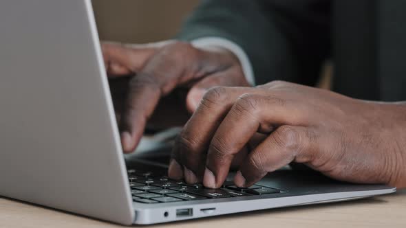 Closeup Male Hands of Unrecognizable Mature Adult Businessman in Formal Suit in Office Desk Using