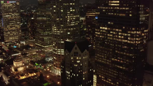 City Downtown Building at Night in Los Angeles California Rising Up Aerial Drone Wide Angle Shot