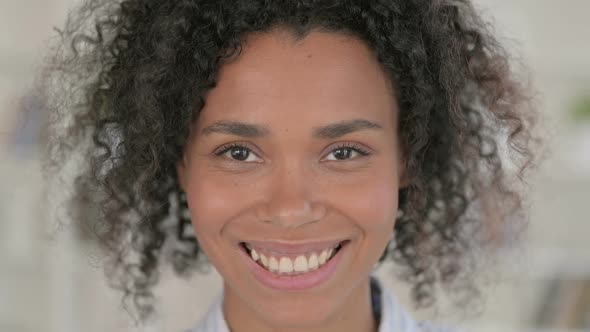 Close Up of Beautiful African Woman Smiling at Camera