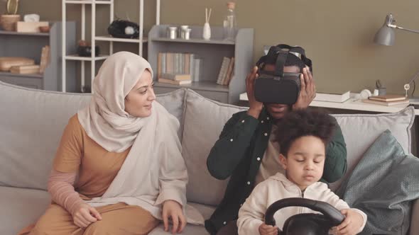 Interracial Muslim Family Experiencing Virtual Reality at Home