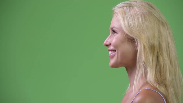 Profile View of Young Happy Beautiful Businesswoman Smiling