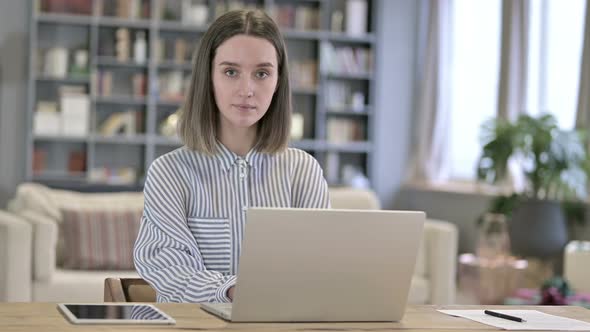 Attractive Young Woman Getting Shocked in Office