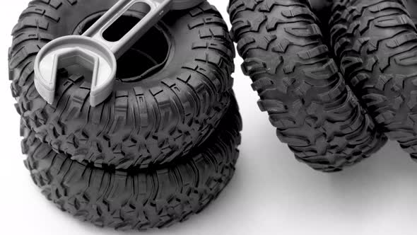 car repair and maintenance,tires replacement. rubber black tires from toy car grey little plastic