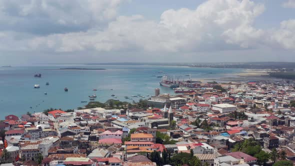 Drone Flying Over the Shoreline in Stone Town Zanzibar Tanzania