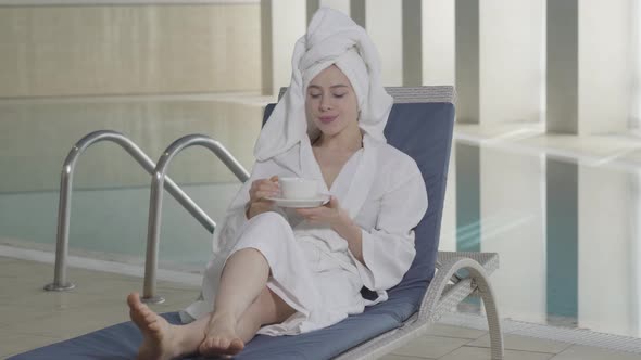 Portrait of Young Charming Caucasian Girl Resting in Spa on Vacations. Happy Beautiful Woman in