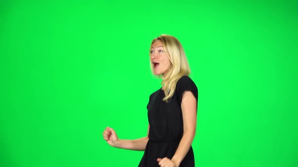 Cheerful Girl Walking, Dancing and Singing. Chroma Key. Slow Motion