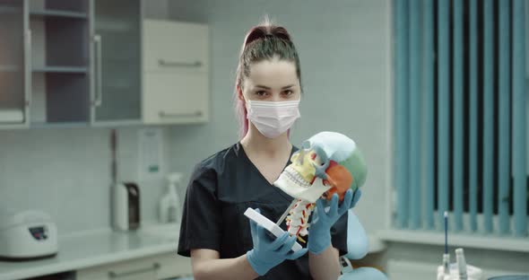 Portrait of a Young Woman Doctor with a Surgical