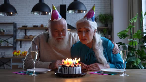 Joyful Elderly Couple During Birthday Celebration