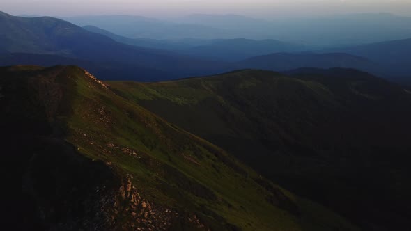 Aerial view of colorful sunset on top of Carpathian Mountains range