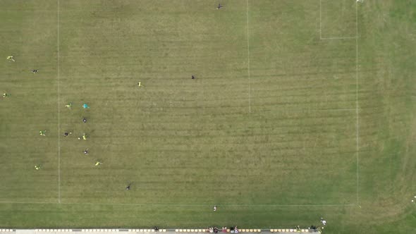 Aerial Top Down View of Soccer Field and Two Professional Teams Playing Soccer