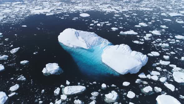 Aerial Flight Over Iceberg Among Antarctica Ocean