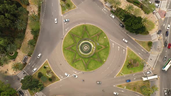 Aerial view of cars circulating big roundabout in Malaga, Spain.