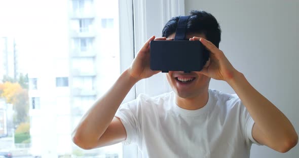 Man using virtual reality headset at home 4k