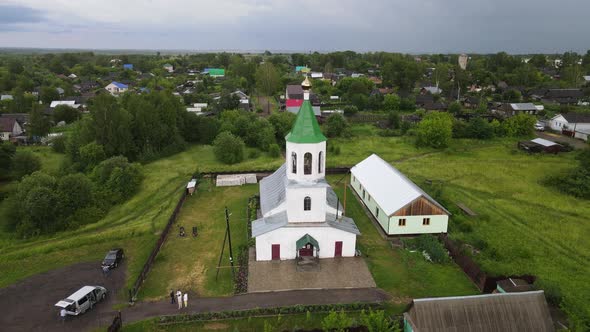 Old Church with Dome and Cross in Suburb