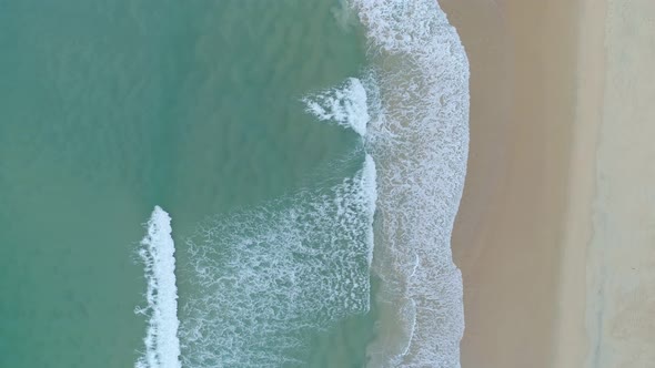 Phuket sea beautiful waves crashing on beach Aerial view