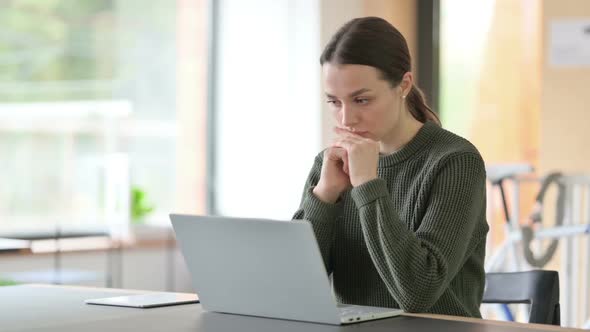 Pensive Woman Thinking at Work Brainstorming