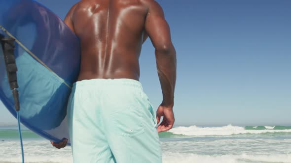 African American man ready to go surf