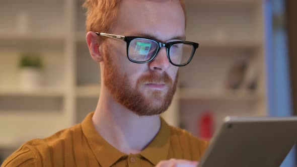 Close Up of Redhead Man Using Digital Tablet with Chroma Screen 