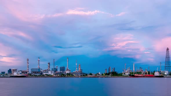 Oil refinery petrochemical and energy industry, day to night, pan right - Time-lapse