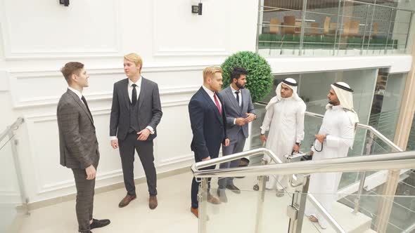 Business People Meet Each Other at Stairs