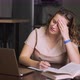Woman is Sitting at Her Desk at Home and Has Headache - VideoHive Item for Sale