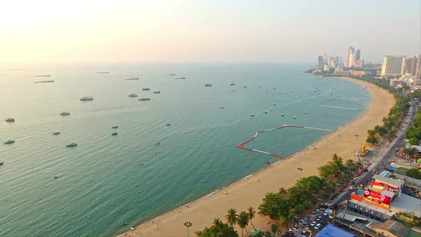 Time-lapse of traffic both boats and cars along the Thai shoreline.