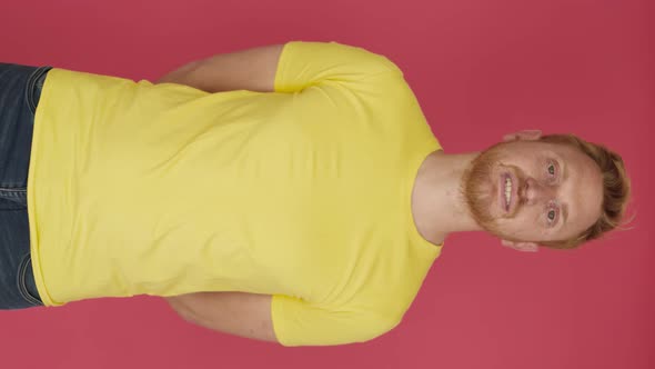 Redhead Young Man Crossing Arms and Smiling at Camera Over Isolated Background