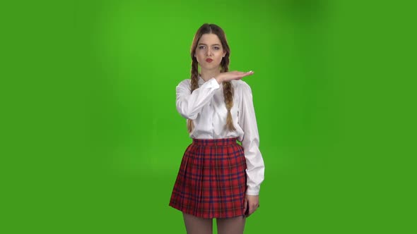 Student Shows a Fist, She Is Angry. Green Screen