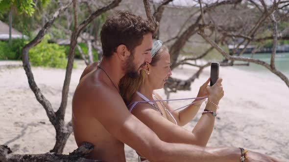 A Static Shot of a Beautiful Young Couple Enjoying at the Beach