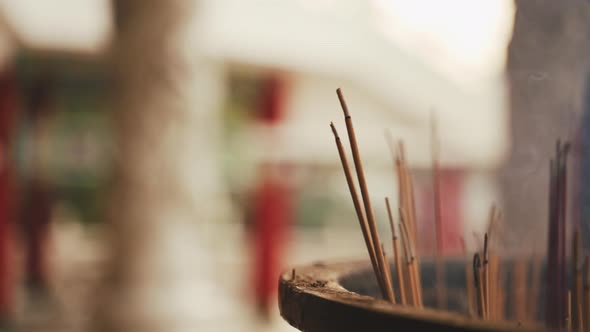 Incense Sticks Burning In Urn