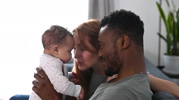 A Happy Multiracial Family of Three at Home