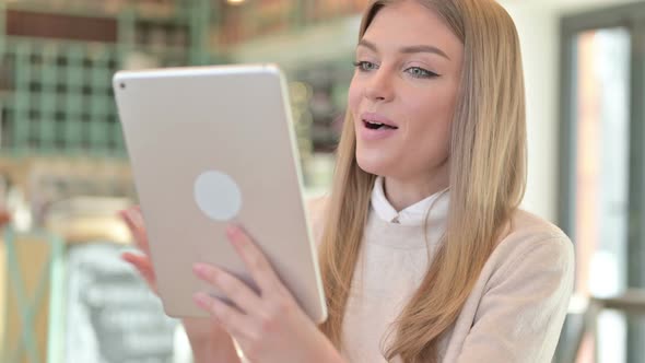 Portrait of Video Chat on Tablet By Young Woman