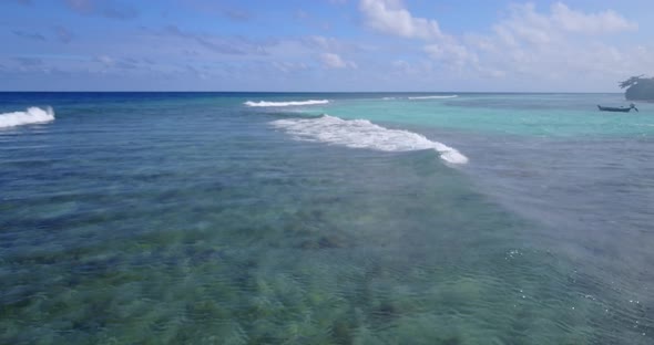 Natural aerial tourism shot of a summer white paradise sand beach and blue water background in vibra