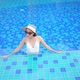 Young asian woman enjoy around outdoor swimming pool for leisure - VideoHive Item for Sale