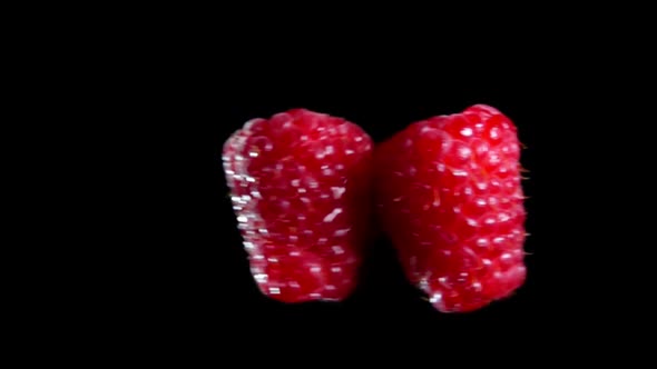 Two Wet Raspberries Collide with Each Other