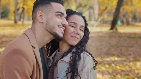 Dreamy Arabic Couple Looking Into Distance Outdoors Partners in Love Enjoy Spending Time Together