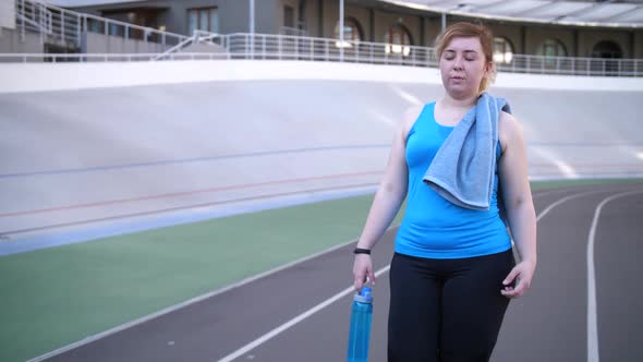 Tired Overweight Woman Walking After Workout