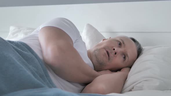 Gray Hair Man Waking Up in Shock By Nightmare