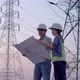 Two specialist electrical engineer working near to High voltage tower. - VideoHive Item for Sale
